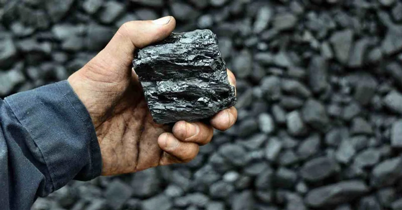 Solid bitumen held above stored material